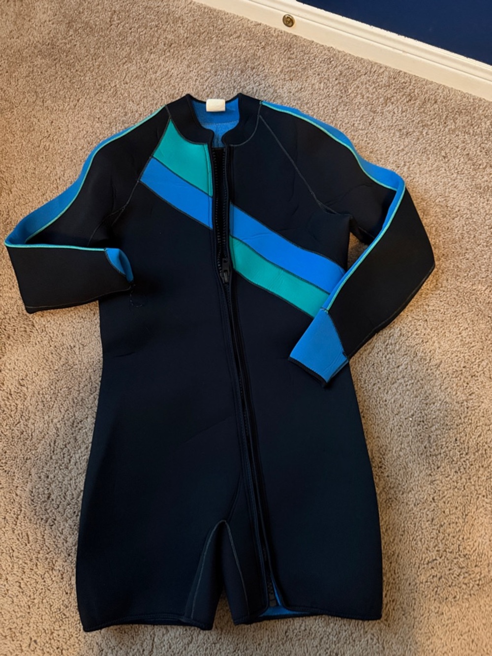 Ladies size medium, zip front, long sleeve, short wetsuit